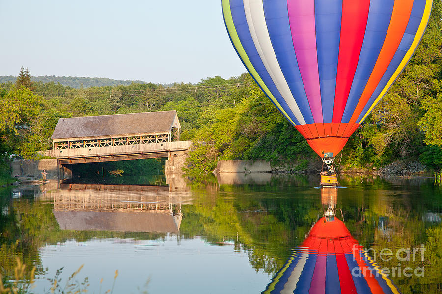 Hot Air Balloon Dipping near the Quechee Covered Bridge Photograph by Susan Cole Kelly
