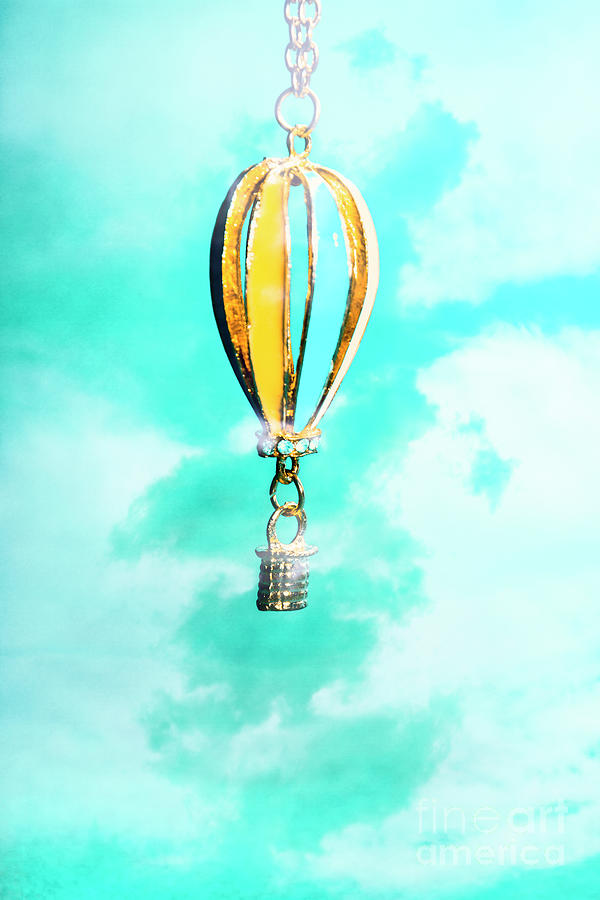 Hot air balloon pendant over cloudy background Photograph by Jorgo Photography