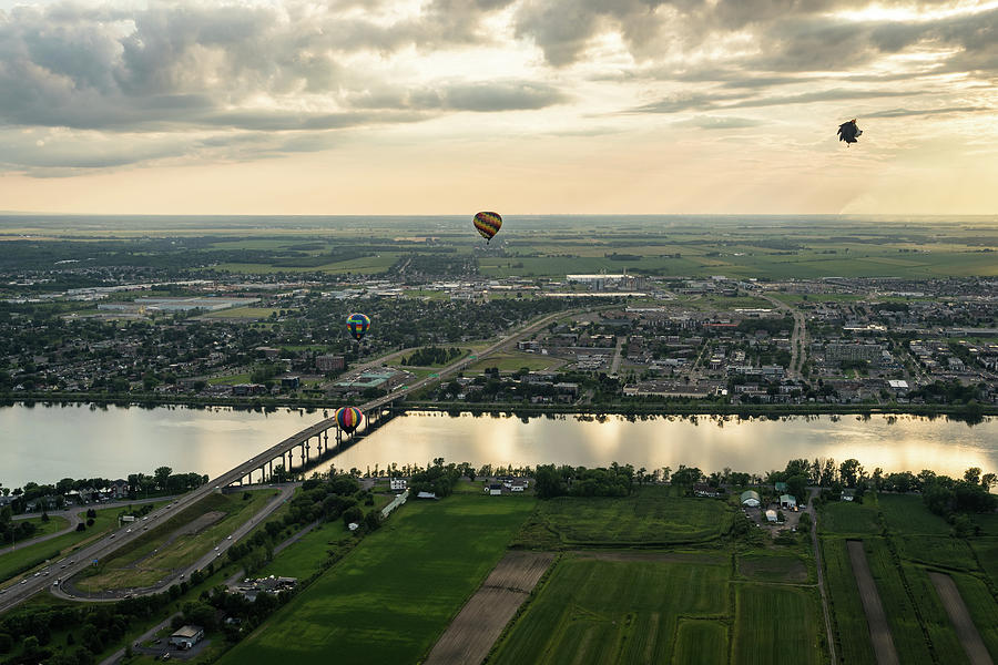 Hot Air Balloons Flying Over Saint-Jean-sur-Richelieu in Quebec Canada Photograph by Georgia Mizuleva
