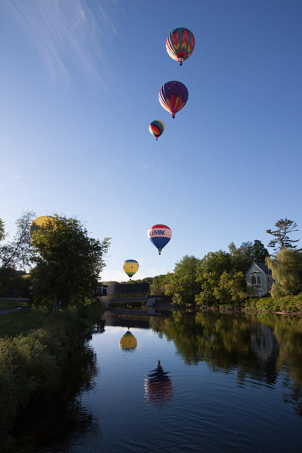 Hot air balloons playing follow the leader Photograph by Jeff Folger