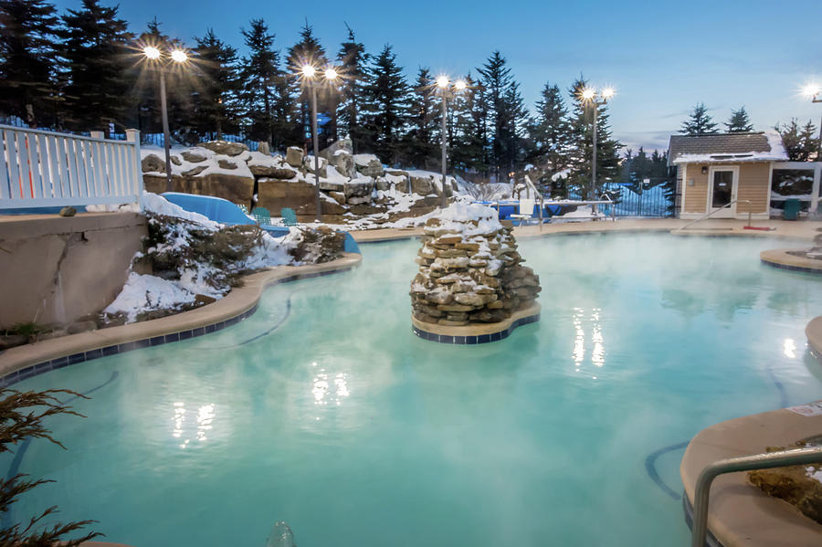 Hot Tubs And Ingound Heated Pool At A Mountain Village In Winter Photograph by Alex Grichenko