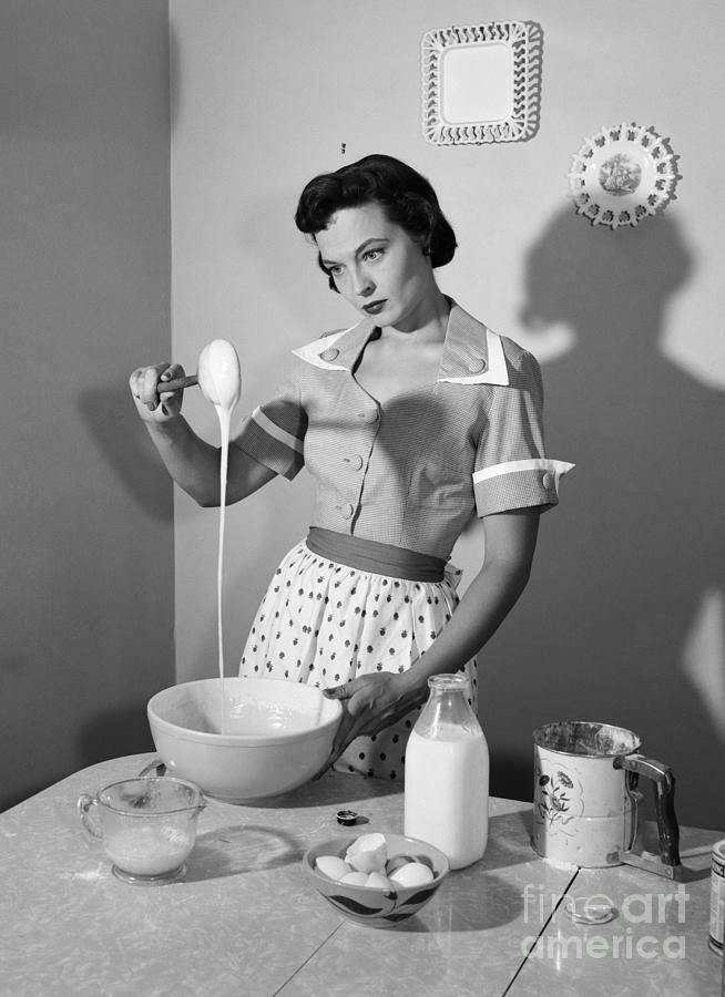 Housewife Cooking With Annoyed Look Photograph by Debrocke/ClassicStock