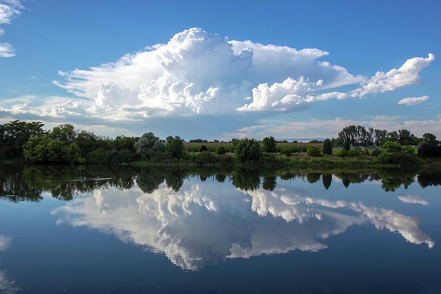 Huge cloud reflection Photograph by Lynn Hopwood
