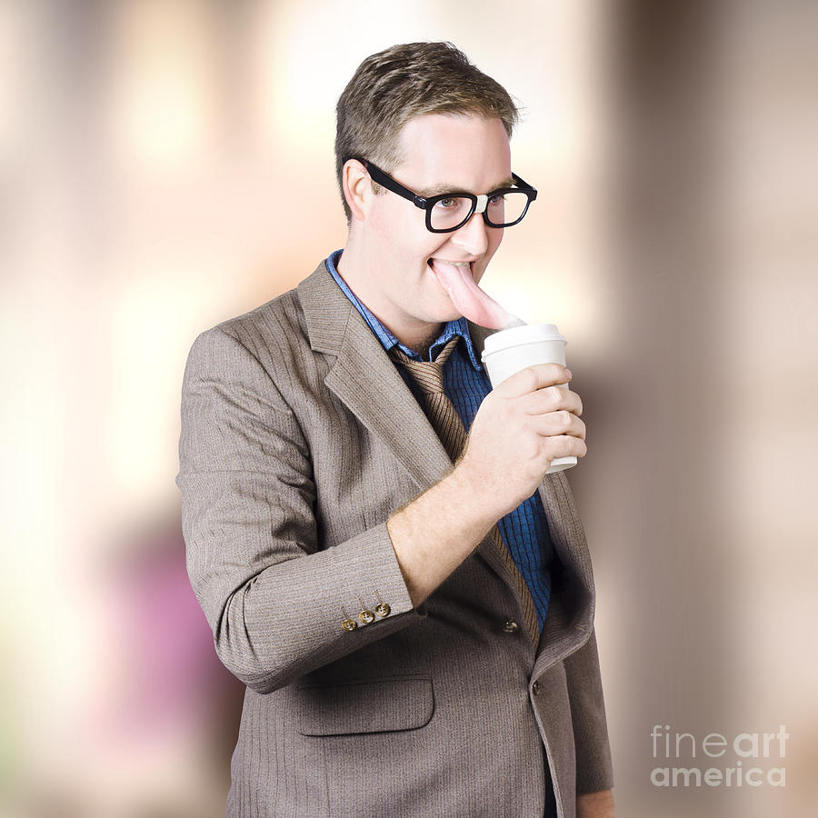 Humorous businessman licking top of coffee cup Photograph by Jorgo Photography