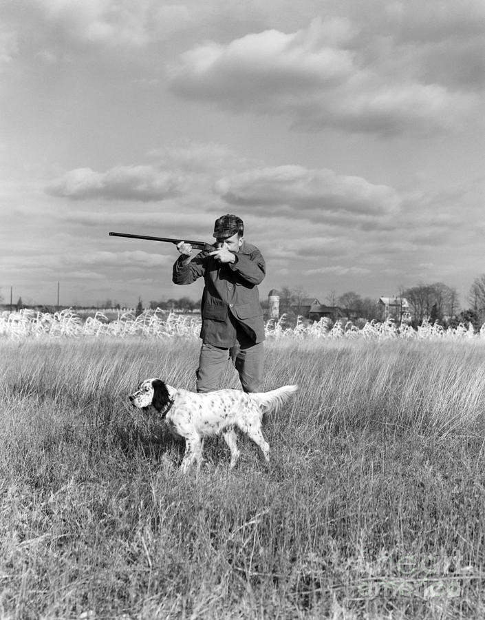 Hunter Aiming Gun, Dog At Side Photograph by H. Armstrong Roberts/ClassicStock