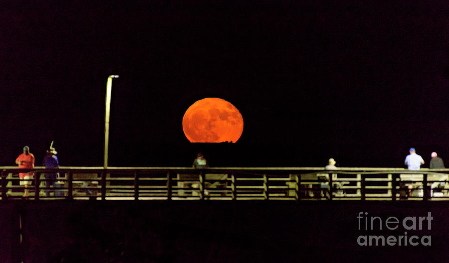 Hunters Moon over Pier Photograph by DJA Images