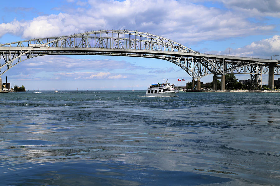 Huron Lady II and Blue Water Bridge Photograph by Mary Bedy