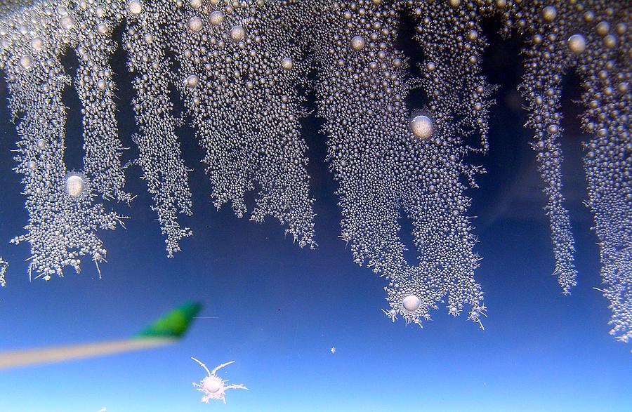 Ice on Plane Window Photograph by Jeanette Oberholtzer