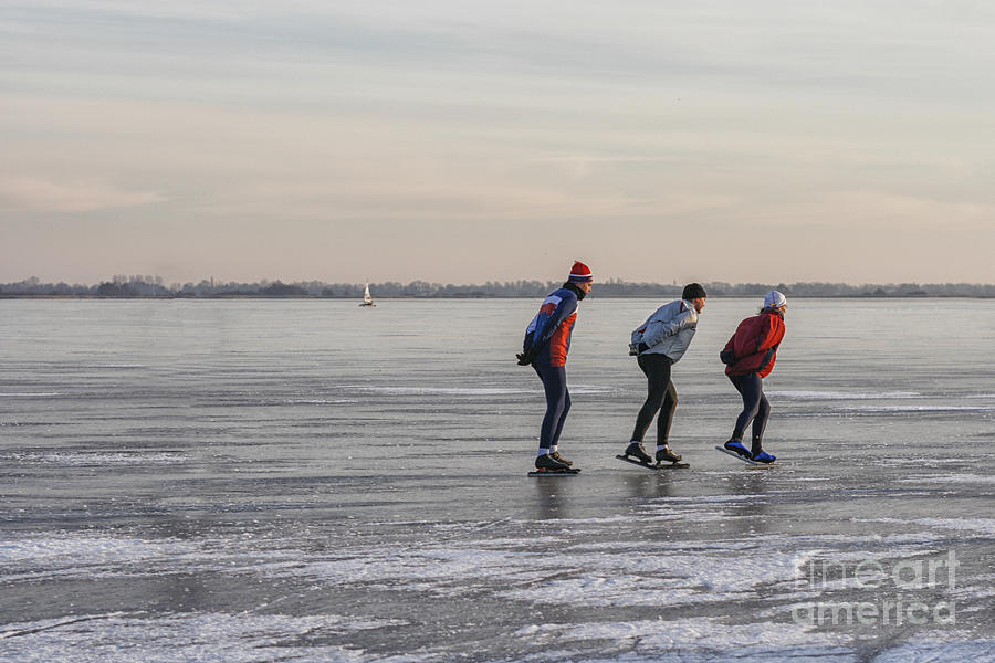 Ice skating on a lake Photograph by Patricia Hofmeester
