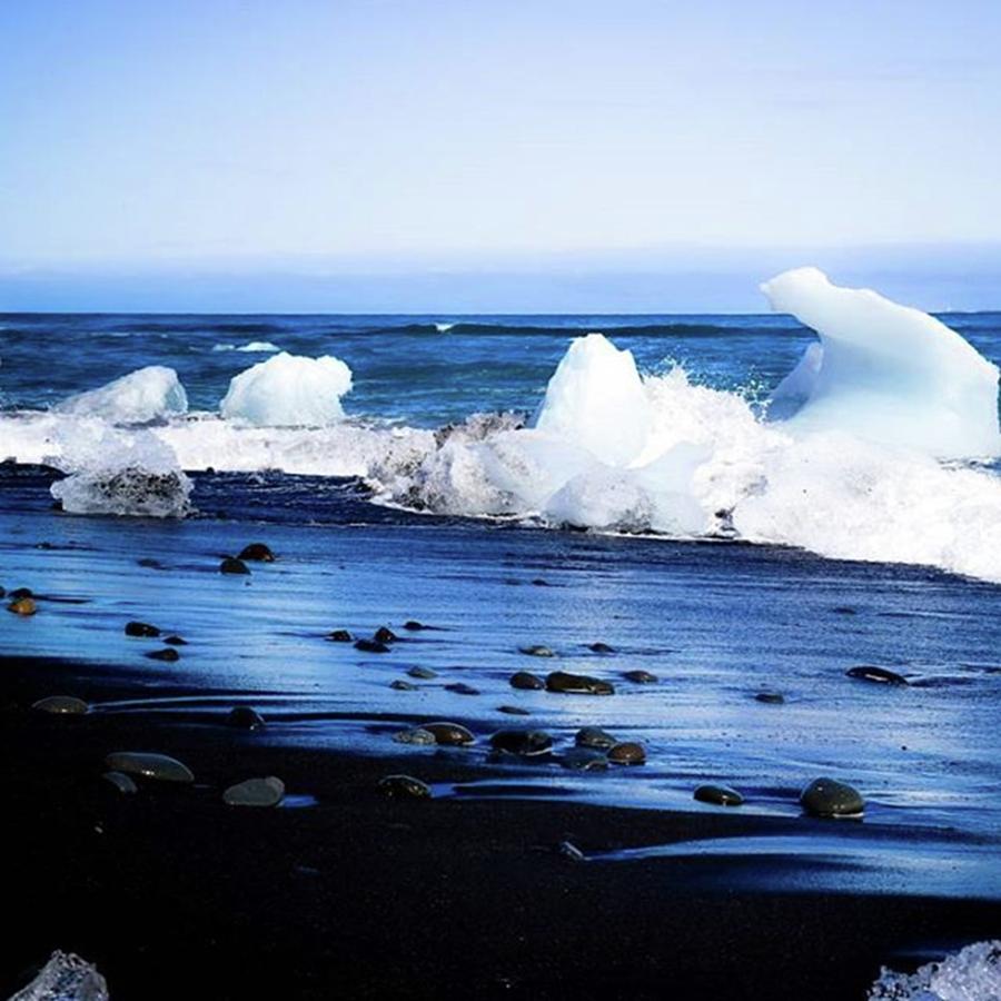 Glacier Photograph - Icebergs Washing Up On The Black Sand by Jesse L