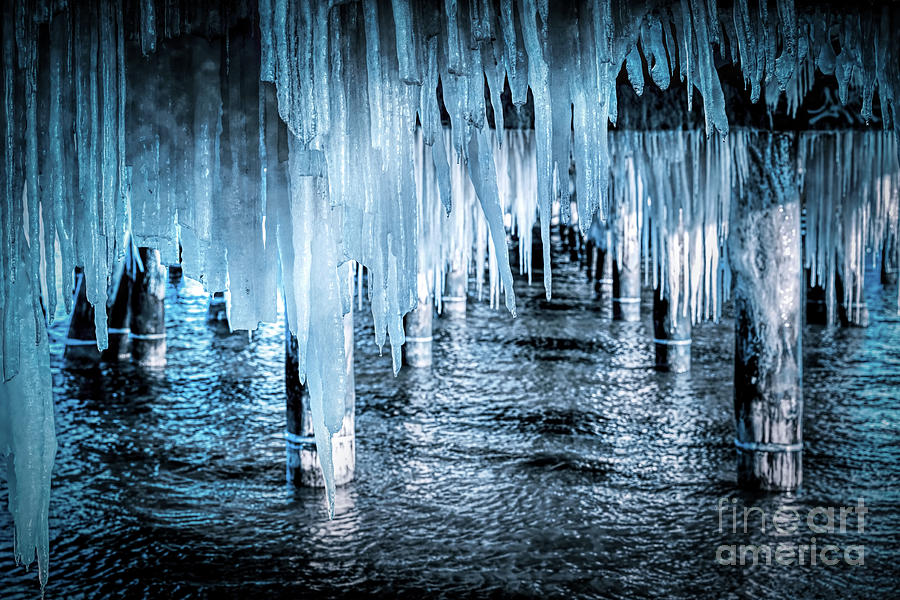 Icicle hanging under jetty roof. Ice, winter. Photograph by Michal Bednarek