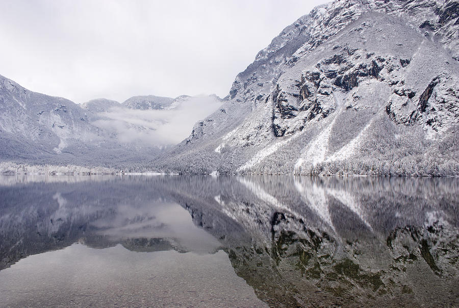 Icy mountain reflections Photograph by Ian Middleton