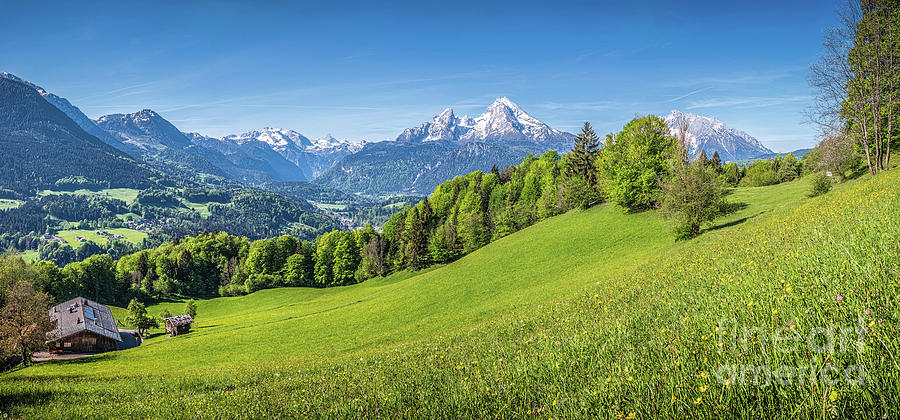 Idyllic alpine landscape with green meadows, farmhouses and snow Photograph by JR Photography