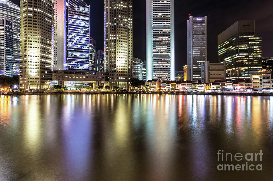 Illuminated skyscrapers in Singapore Photograph by Didier Marti