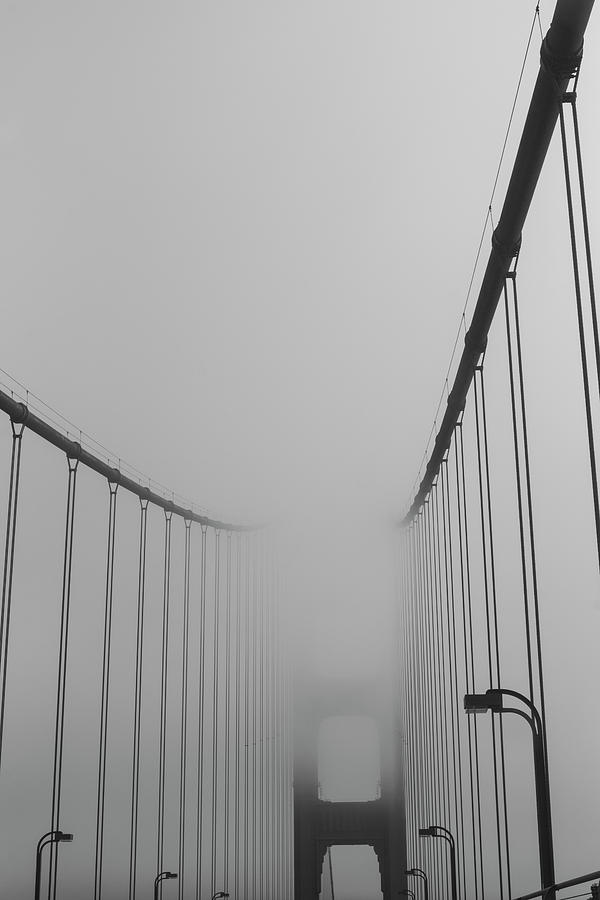 In the clouds- a thick layer of fog over the Golden Gate Bridge San Francisco CA Photograph by Toby McGuire