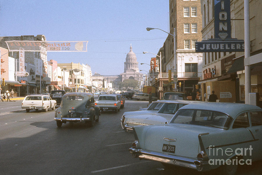 Austin Photograph - A historical 1965 photo antique automobiles fill the downtown Austin streets of Congress Avenue by Dan Herron