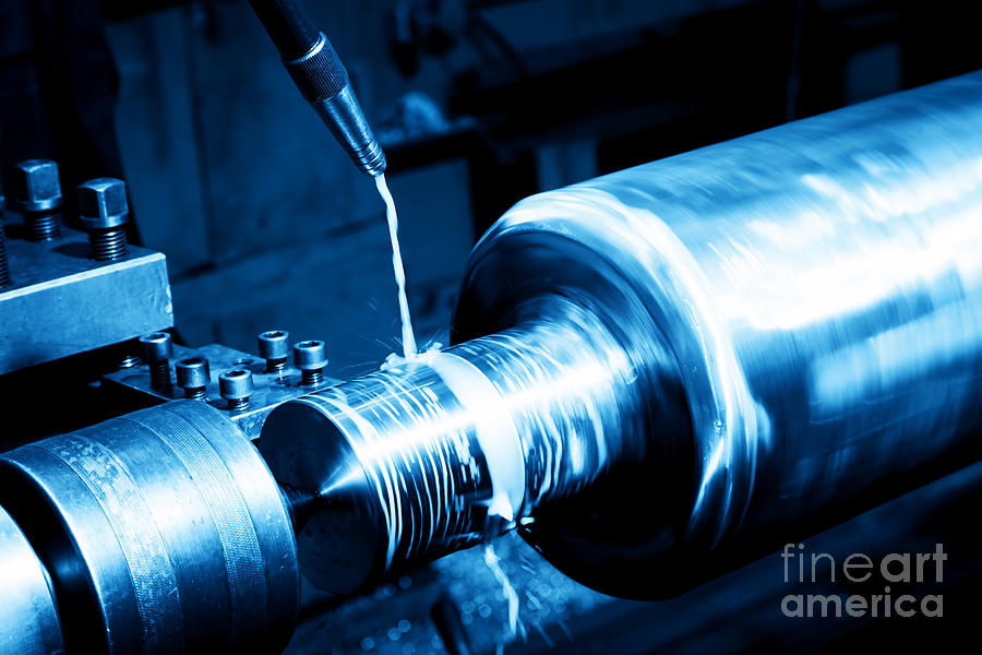 Industrial turning machine at work close-up Photograph by Michal Bednarek