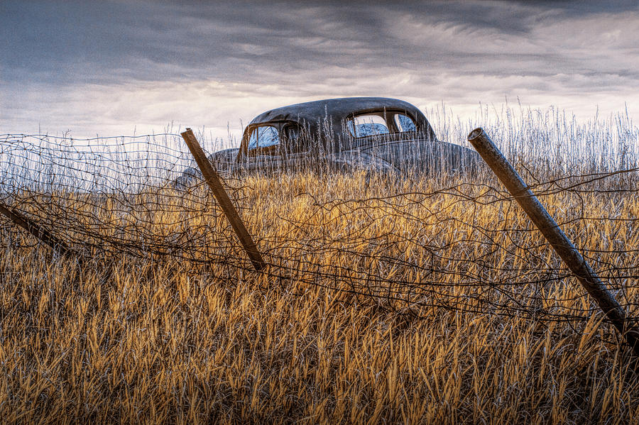Infrared Photo of an Abandoned Auto along a Wire Fence in the Ghost Town by Okaton South Dakota Photograph by Randall Nyhof
