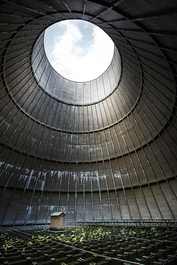 Inside industrial cooling tower stands a mysterous little house Photograph by Dirk Ercken