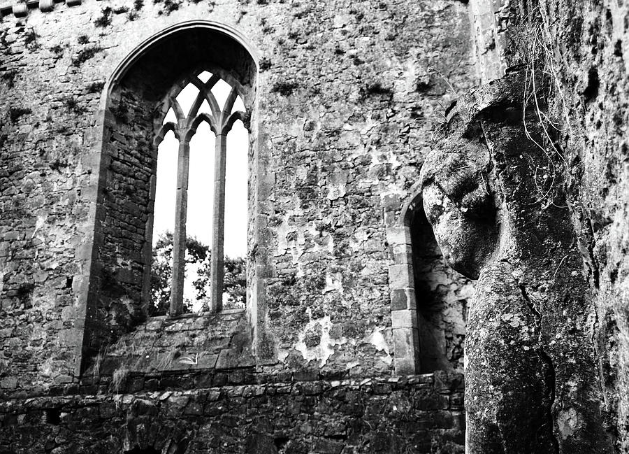 Ireland Athassel Priory Tipperary Medieval Ruins Profile of St Joseph Statue Gothic Window BW Photograph by Shawn OBrien