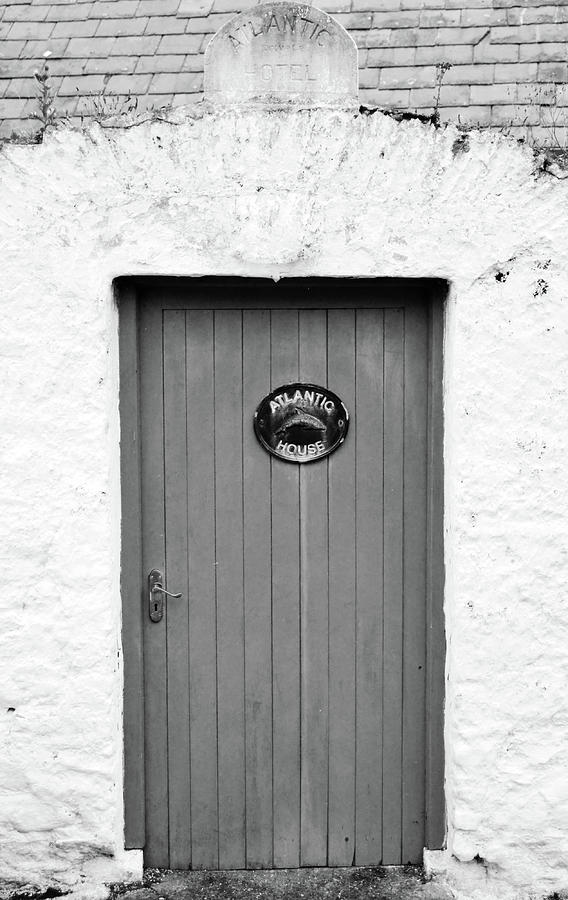 Irish Door Entrance to Atlantic House Hotel Ballycotton County Cork Ireland Black and White Photograph by Shawn OBrien