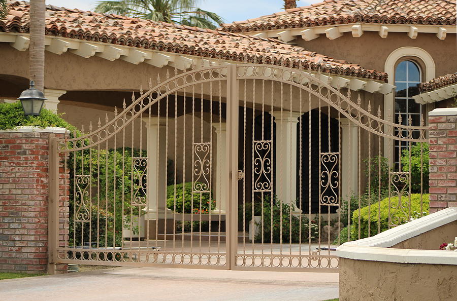 Iron Gate in Front of Desert Home Photograph by Colleen Cornelius