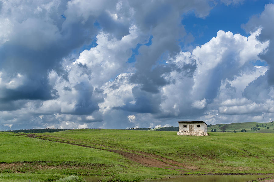 Isolated Barren Shed and Dark Rain Clouds Photograph by John Williams