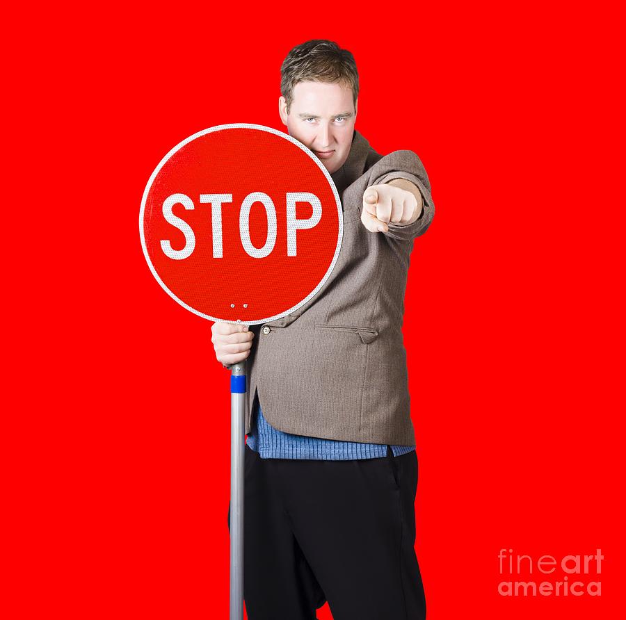 Isolated man holding red traffic stop sign Photograph by Jorgo Photography