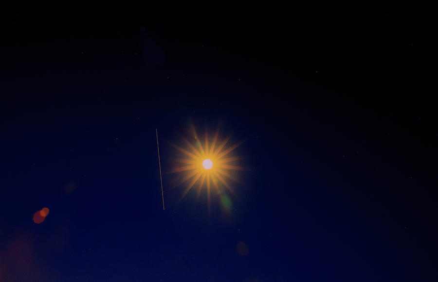 ISS almost transverses the sparkling moon  Photograph by Allan Levin