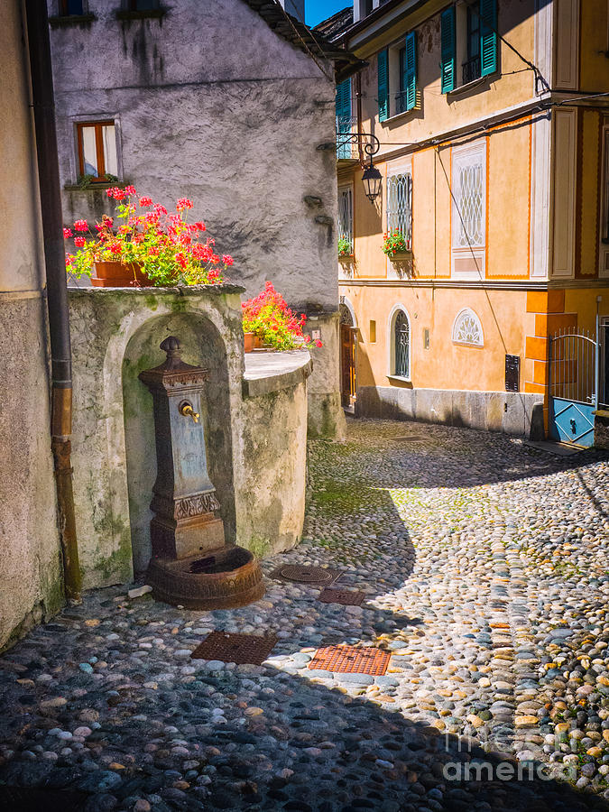 Italian alley with fountain Photograph by Silvia Ganora
