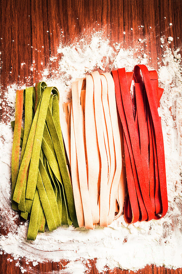 Italian pasta in national flag on flour Photograph by Jorgo Photography