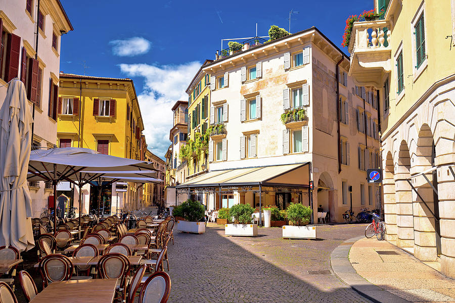 Italian street and cafe in Verona view Photograph by Brch Photography