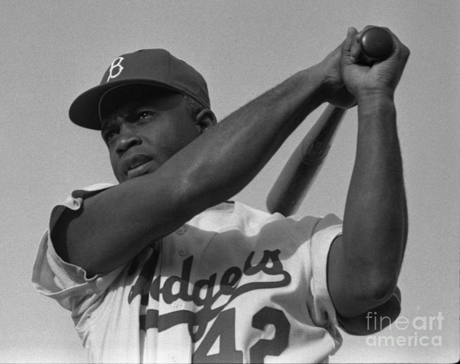 Jackie Robinson swinging a bat in Dodgers uniform Painting by Celestial Images