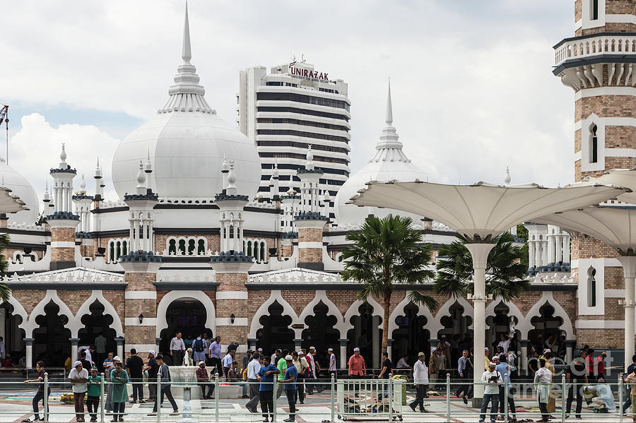 Jamek mosque in the heart of Kuala Lumpur business and financial Photograph by Didier Marti