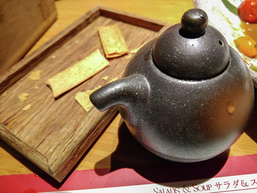 Japanese Teapot On Dining Table In Restaurant Photograph by Alex Grichenko