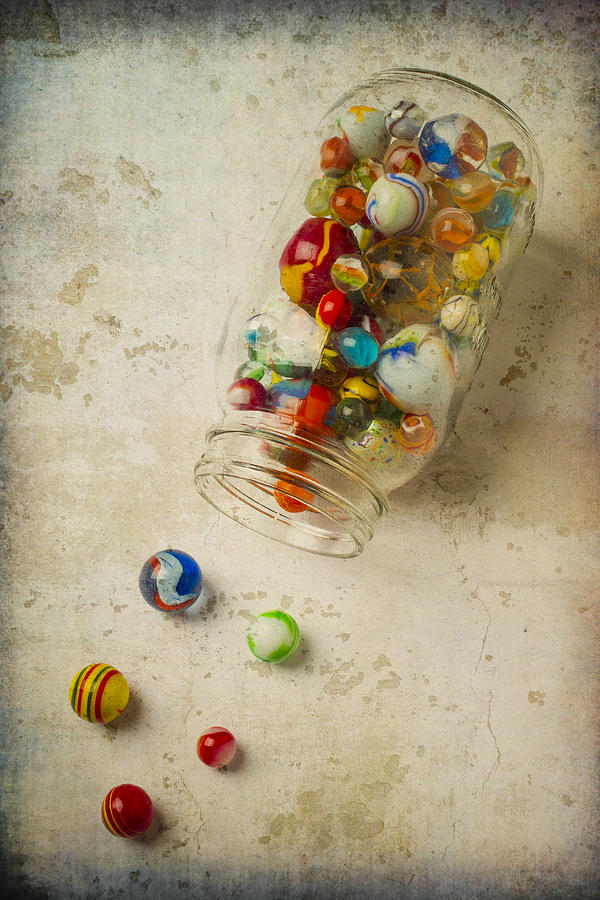 Jar Of Slipt Marbles Photograph by Garry Gay