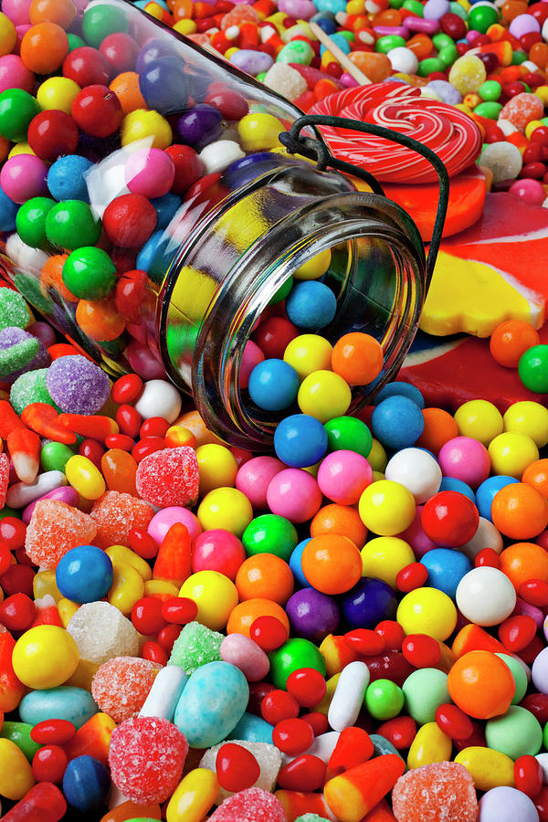 Sucker Photograph - Jar spilling bubblegum with candy by Garry Gay