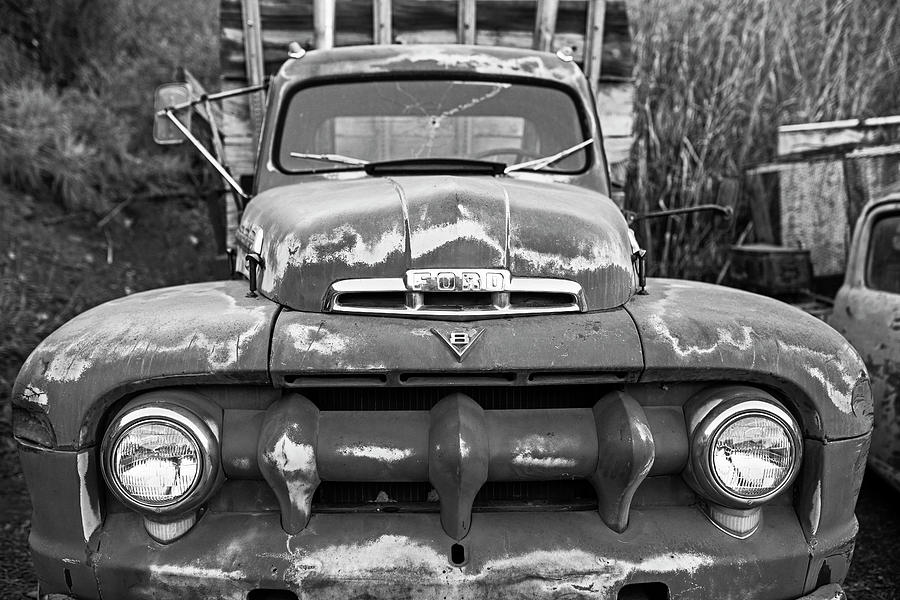 Jerome, AZ Junk Yard Ford V8 Red old Rusty Truck Black and White Photograph by Toby McGuire
