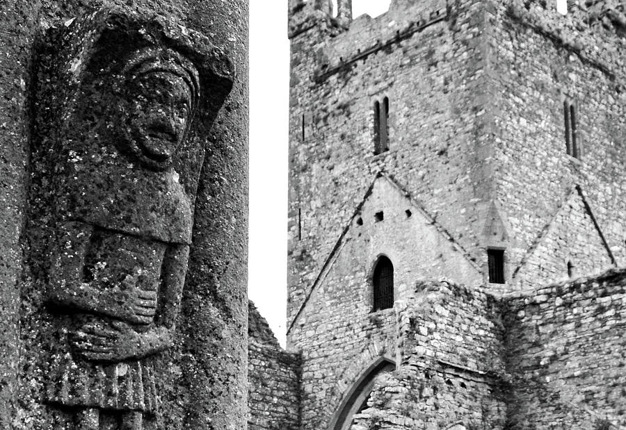 Jerpoint Abbey Tower and Irish Monk Stone Carving County Kilkenny Ireland Black and White Photograph by Shawn OBrien