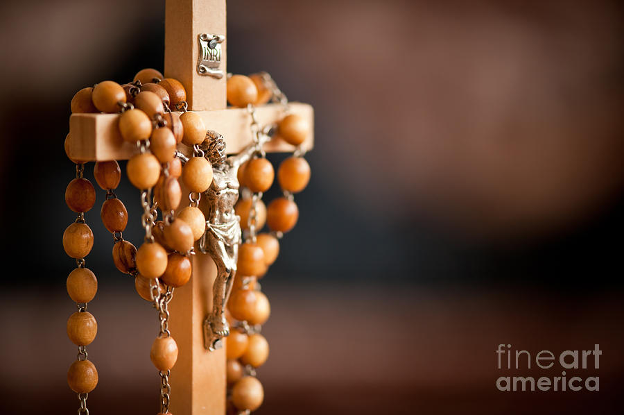 Jesus figurine and rosary Photograph by Arletta Cwalina