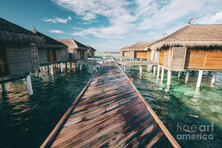 Jetty leading to water villas. Maldives Photograph by Michal Bednarek