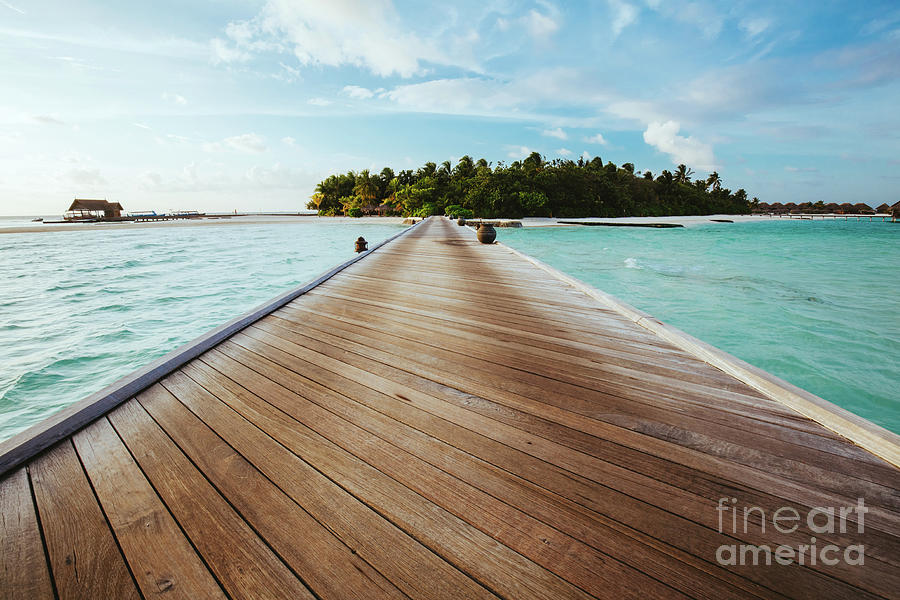 Jetty on sea leading to an island. Photograph by Michal Bednarek
