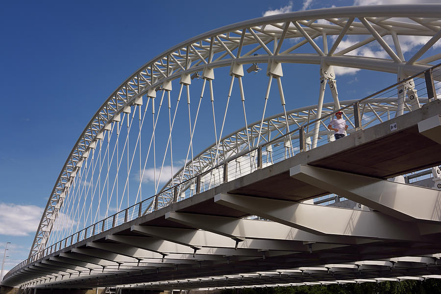 New Photograph - Jogger on new Strandherd Armstrong steel suspension bridge over  by Reimar Gaertner