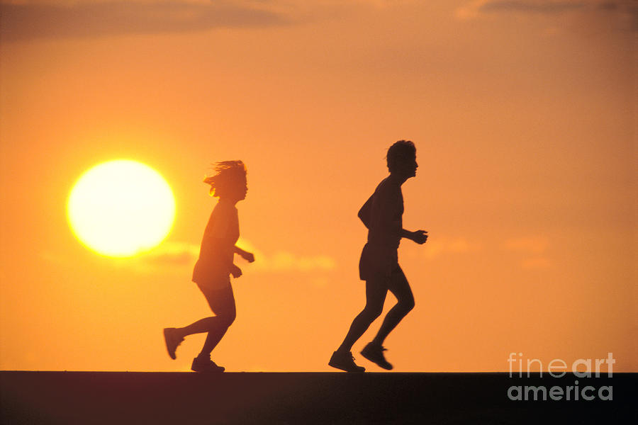 Jogging At Sunset Photograph by Joe Carini - Printscapes
