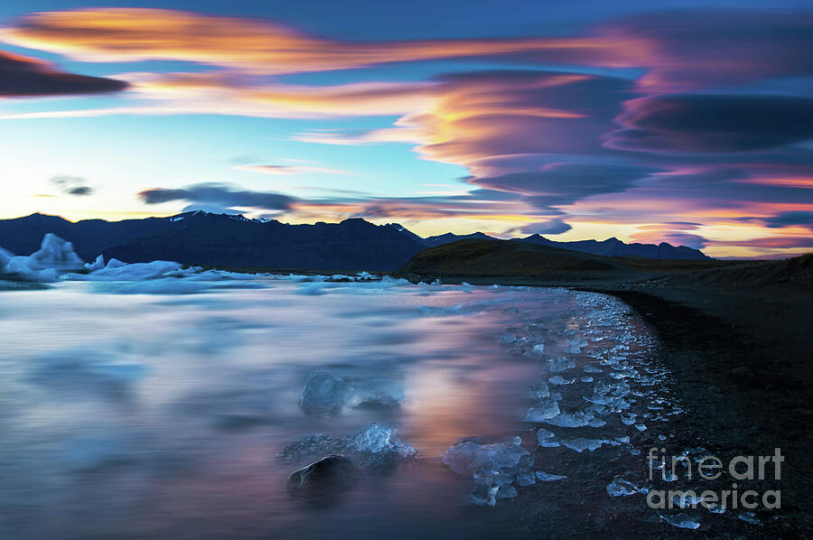Beach Photograph - Jokulsarlon Iceland Glacial Ice Lenticular Sunset by Mike Reid