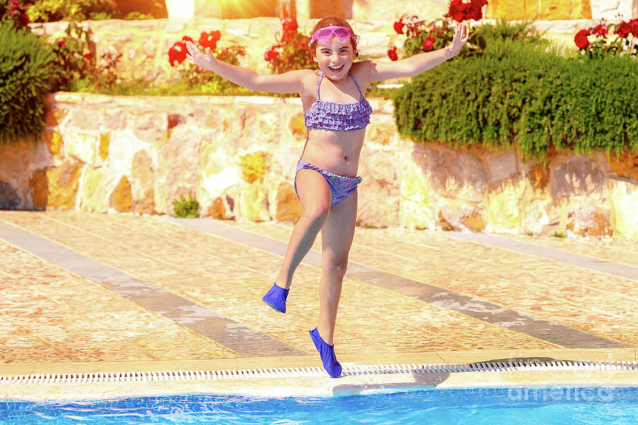 Joyful girl jumping to the pool Photograph by Anna Om