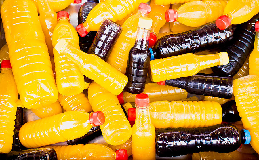 Bottle Photograph - Juice bottles by Tom Gowanlock
