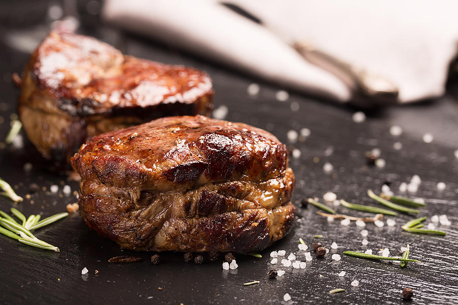 Cow Photograph - Juicy Steak with rosemary by Vadim Goodwill