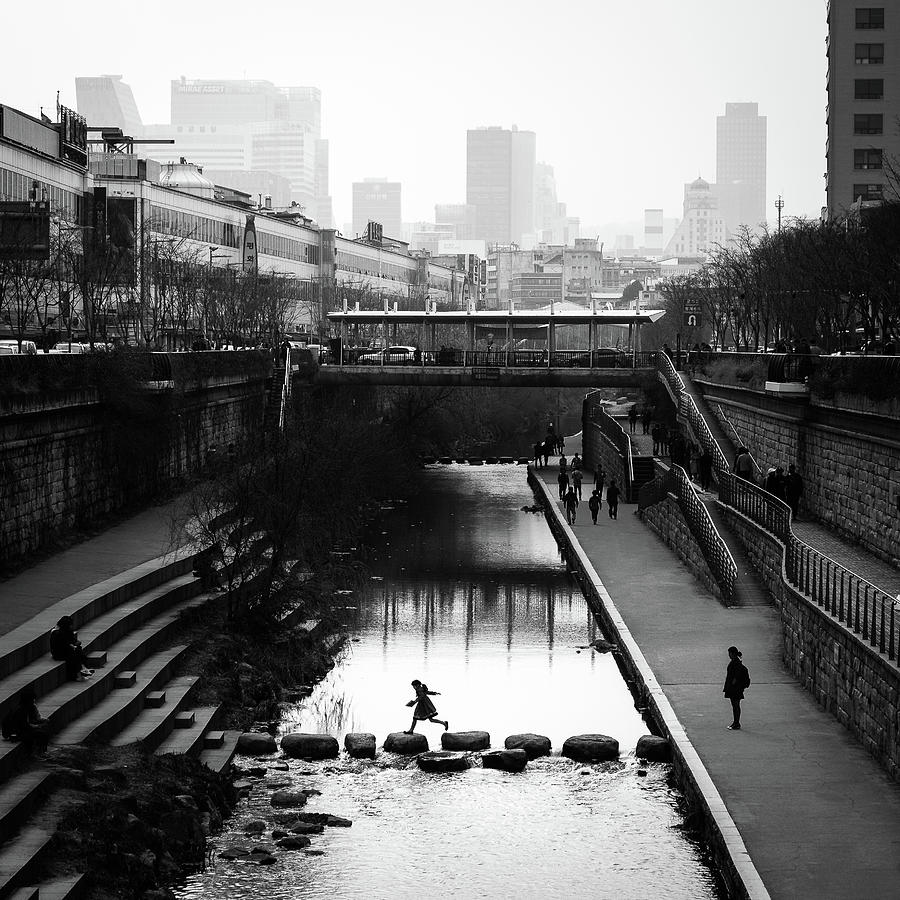 Black And White Photograph - Jump - Seoul, South Korea - Black and white street photography by Giuseppe Milo