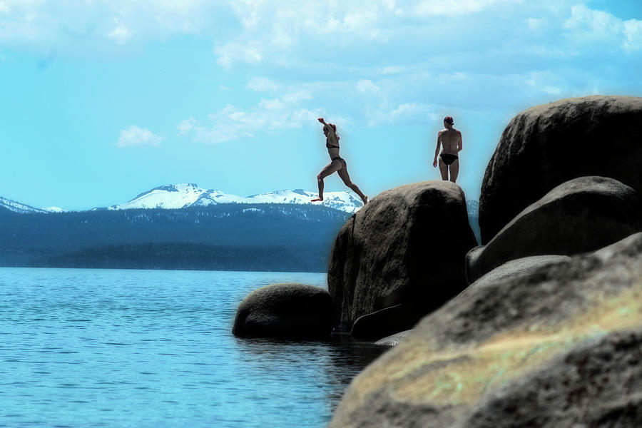 Jumping into the cold Lake Tahoe water Photograph by Dan Friend